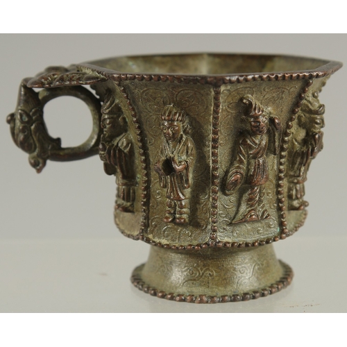 88 - A CHINESE BRONZE CUP WITH RELIEF CAST FIGURES, mark to base possibly Da Tang Zhen Guan (true officia... 