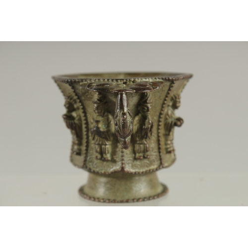 88 - A CHINESE BRONZE CUP WITH RELIEF CAST FIGURES, mark to base possibly Da Tang Zhen Guan (true officia... 