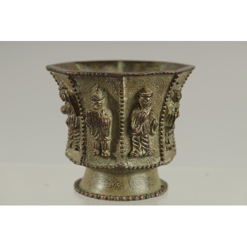 88 - A CHINESE BRONZE CUP WITH RELIEF CAST FIGURES, mark to base possibly Da Tang Zhen Guan (true officia... 