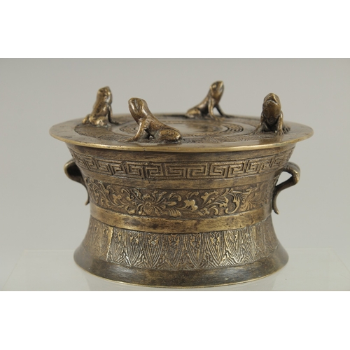 89 - AN ANNAMESE BRONZE RAIN DRUM WITH RELIEF CAST FROGS, 16cm diameter.