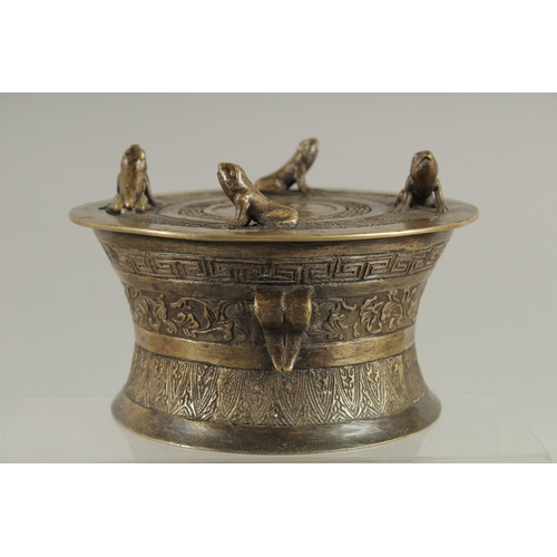 89 - AN ANNAMESE BRONZE RAIN DRUM WITH RELIEF CAST FROGS, 16cm diameter.