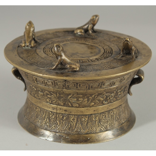 89 - AN ANNAMESE BRONZE RAIN DRUM WITH RELIEF CAST FROGS, 16cm diameter.