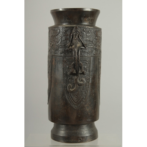 90 - A CHINESE BRONZE VASE WITH TWIN CHILONG HANDLES, with archaic style mask decoration, 28cm high.