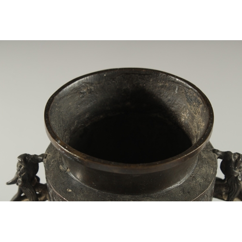 90 - A CHINESE BRONZE VASE WITH TWIN CHILONG HANDLES, with archaic style mask decoration, 28cm high.