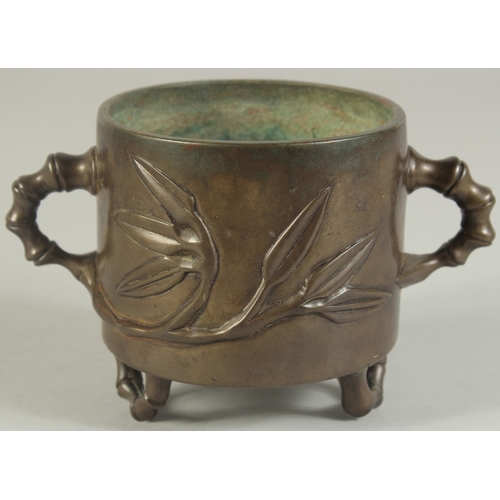 91 - AN 18TH-19TH CENTURY CHINESE BAMBOO DESIGN BRONZE CENSER, with bamboo-form twin handles and raised o... 