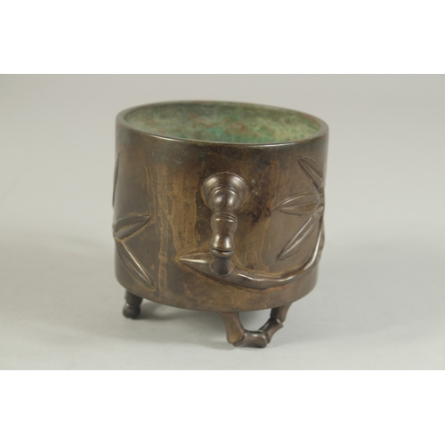 91 - AN 18TH-19TH CENTURY CHINESE BAMBOO DESIGN BRONZE CENSER, with bamboo-form twin handles and raised o... 