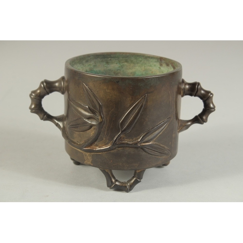 91 - AN 18TH-19TH CENTURY CHINESE BAMBOO DESIGN BRONZE CENSER, with bamboo-form twin handles and raised o... 