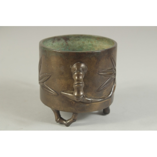 91 - AN 18TH-19TH CENTURY CHINESE BAMBOO DESIGN BRONZE CENSER, with bamboo-form twin handles and raised o... 