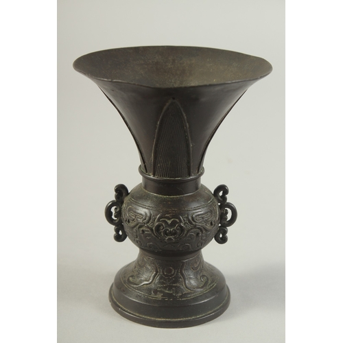 92 - A CHINESE BRONZE TWIN HANDLE VASE, Ming dynasty or later, 13.5cm high.