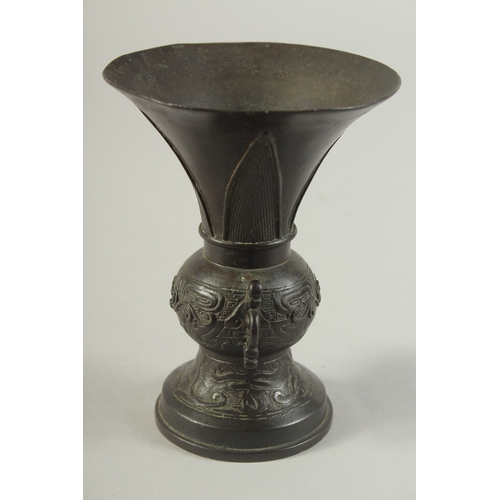 92 - A CHINESE BRONZE TWIN HANDLE VASE, Ming dynasty or later, 13.5cm high.