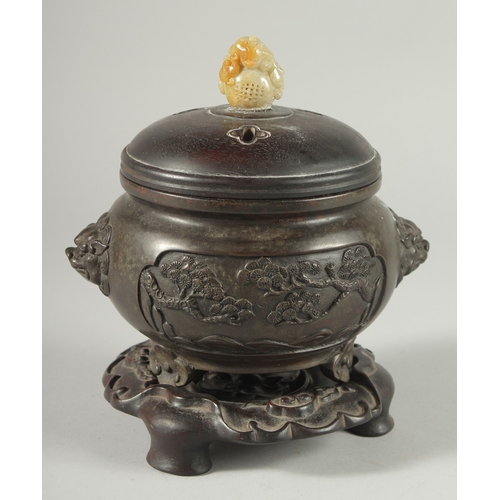 39 - A CHINESE ARCHAIC STYLE BRONZE CENSER WITH CARVED JADE MOUNTED HARDWOOD COVER, on a fitted hardwood ... 