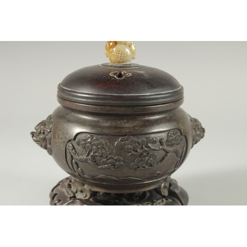 39 - A CHINESE ARCHAIC STYLE BRONZE CENSER WITH CARVED JADE MOUNTED HARDWOOD COVER, on a fitted hardwood ... 