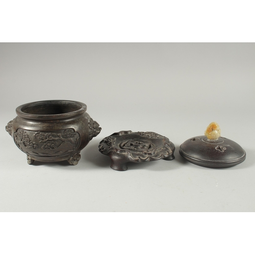 39 - A CHINESE ARCHAIC STYLE BRONZE CENSER WITH CARVED JADE MOUNTED HARDWOOD COVER, on a fitted hardwood ... 