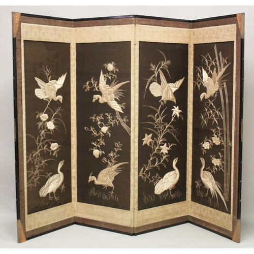 68 - A CHINESE SILVER-THREAD EMBROIDERED FOUR-PANEL FOLDING SCREEN, decorated with birds and flora, end p... 