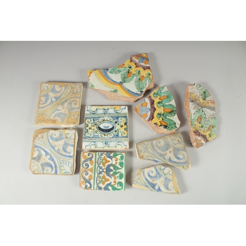 298 - NINE 17TH CENTURY GLAZED POTTERY POLYCHROME TILE FRAGMENTS, various sizes, (9).