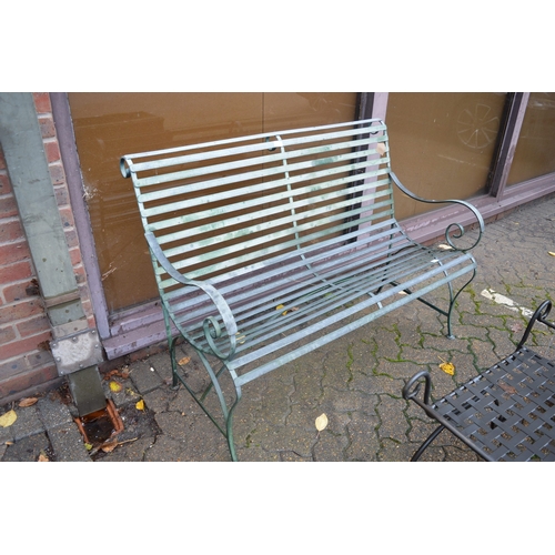 1 - A wrought iron two seater garden bench.