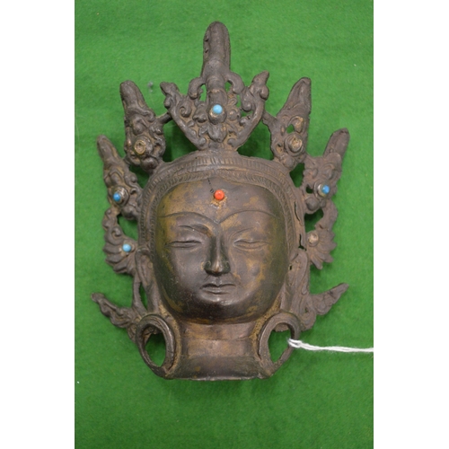 1004 - A small bronze head of an Eastern Deity.