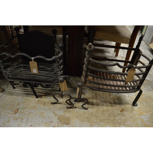 105 - Two wrought iron fire baskets and a pair of fire dogs.