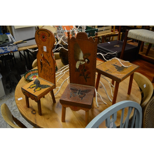 114 - Two decorative small wooden chairs and a similar table.