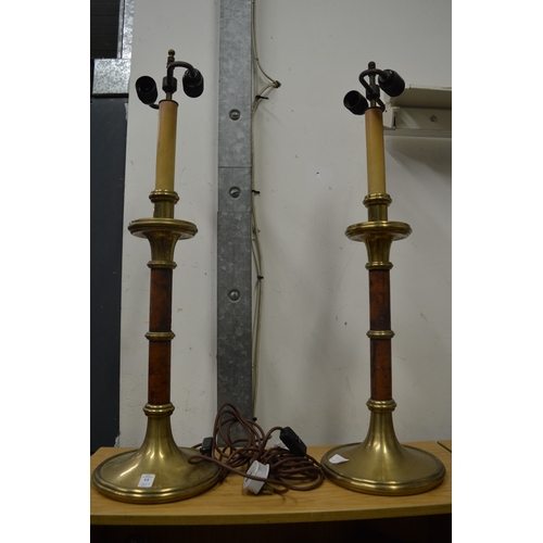 15 - A large pair of brass and leather table lamps.