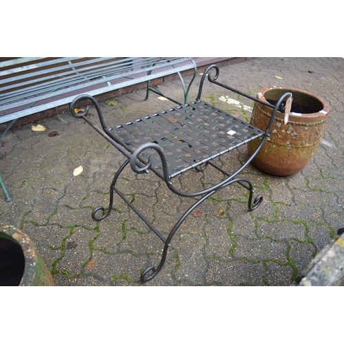 2 - A wrought iron seat.