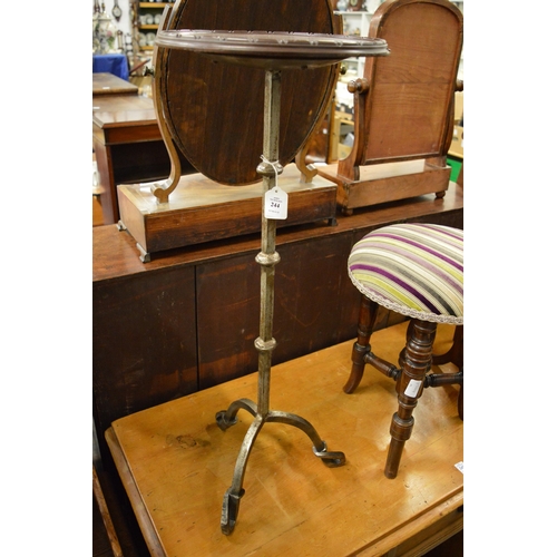 244 - A wrought iron occasional table with mahogany top.