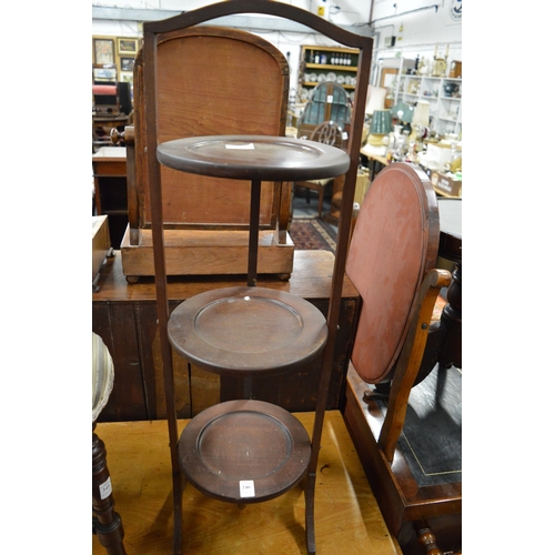 246 - A mahogany folding cake stand.