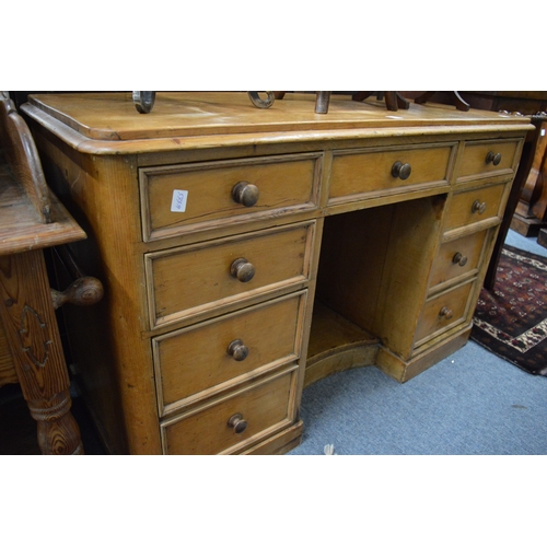 247 - A 19th century pine kneehole desk or dressing table.