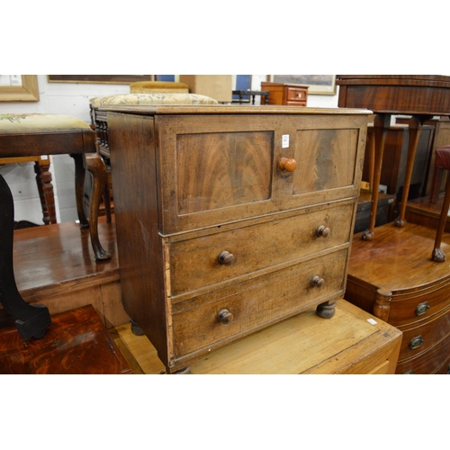 267 - A 19th century mahogany commode with rising top and porcelain liner.