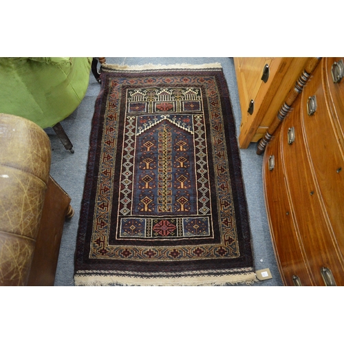 271 - A Persian prayer rug blue ground with stylised decoration 145cm x 88cm.