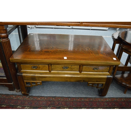 275 - A Chinese elm coffee table with drawers running through to each side.