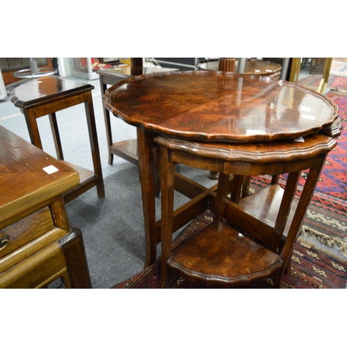 276 - A walnut nest of tables.