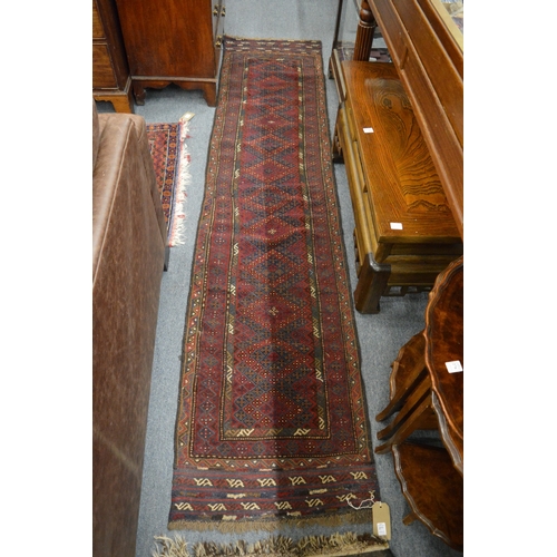277 - A good Persian runner with stylised geometric decoration 265cm x 60cm.