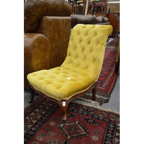 281 - A Victorian gold draylon button upholstered nursing chair.