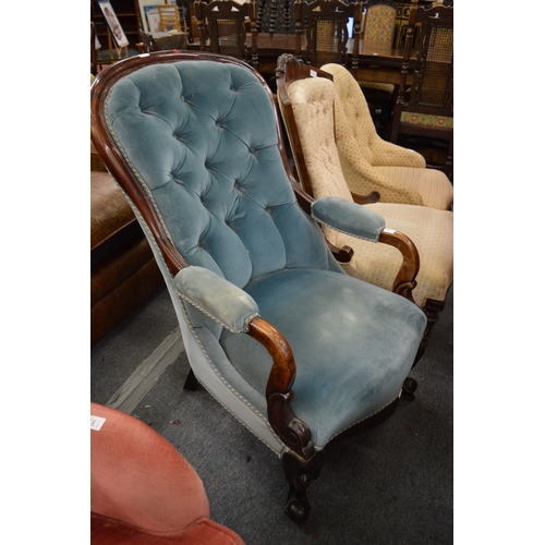 292 - A Victorian mahogany framed and button upholstered open armchair.