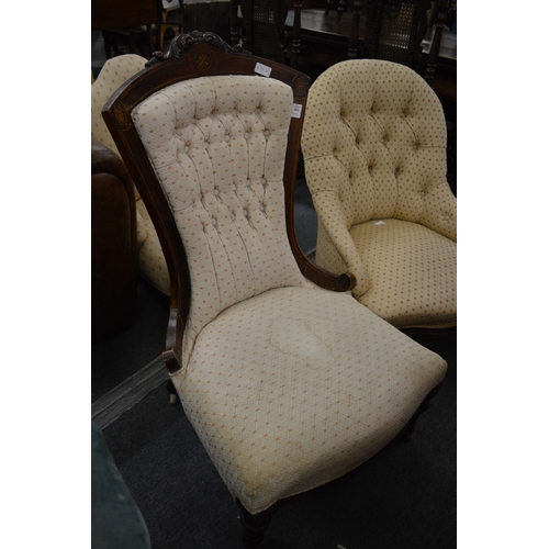 293 - A Victorian inlaid walnut and button upholstered nursing chair.