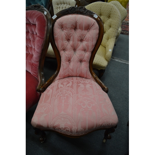 295 - A Victorian walnut framed and button upholstered nursing chair.