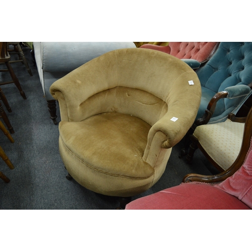 297 - A Victorian horseshoe shaped upholstered armchair.