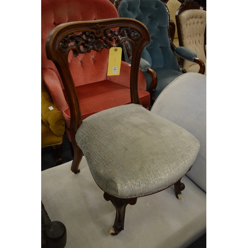 299 - A Victorian walnut occasional chair.