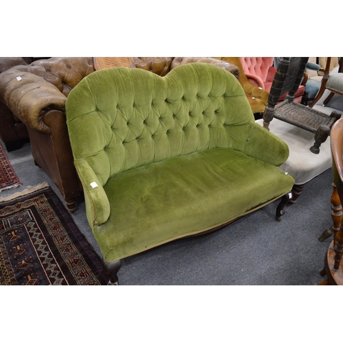 301 - A Victorian green draylon button upholstered two seater settee.