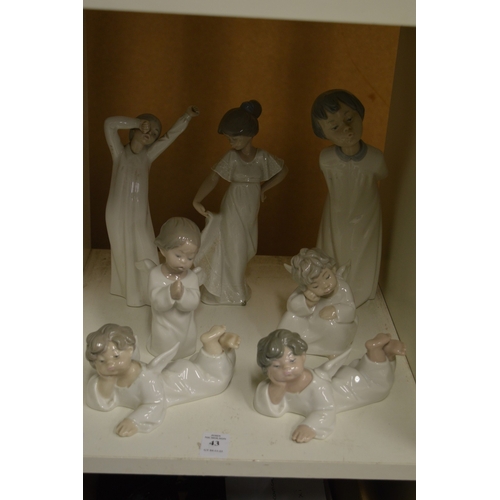 43 - Lladro and Nao figures.