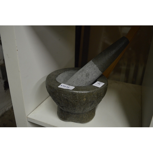 48 - A stone pestle and mortar.