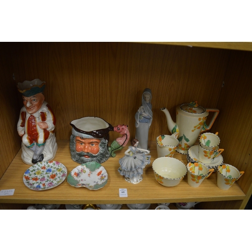 60 - A shelf of decorative china.