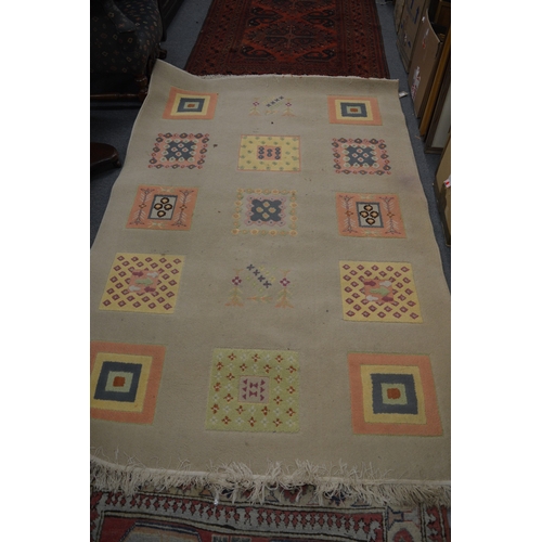 71 - A modern machine made rug 220cm x 148cm.