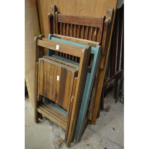 72 - Four folding chairs.