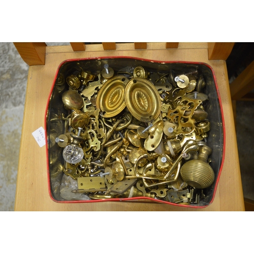 74 - Quantity of furniture brass ware to include locks, handles, castors etc.