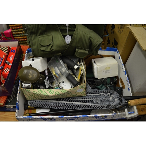 94 - A quantity of fishing equipment to include reels, landing net, waistcoat etc.