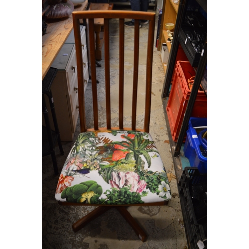 65 - A set of four stylish teak dining chairs.