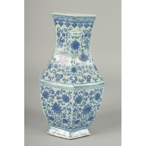 100 - A CHINESE BLUE AND WHITE PORCELAIN HEXAGONAL VASE, with twin cylindrical tubed handles and lotus dec... 