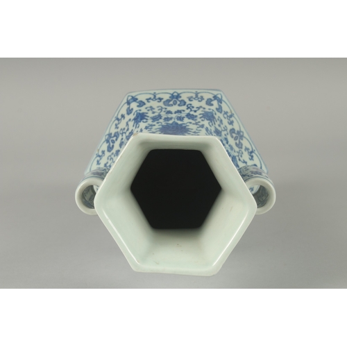 100 - A CHINESE BLUE AND WHITE PORCELAIN HEXAGONAL VASE, with twin cylindrical tubed handles and lotus dec... 